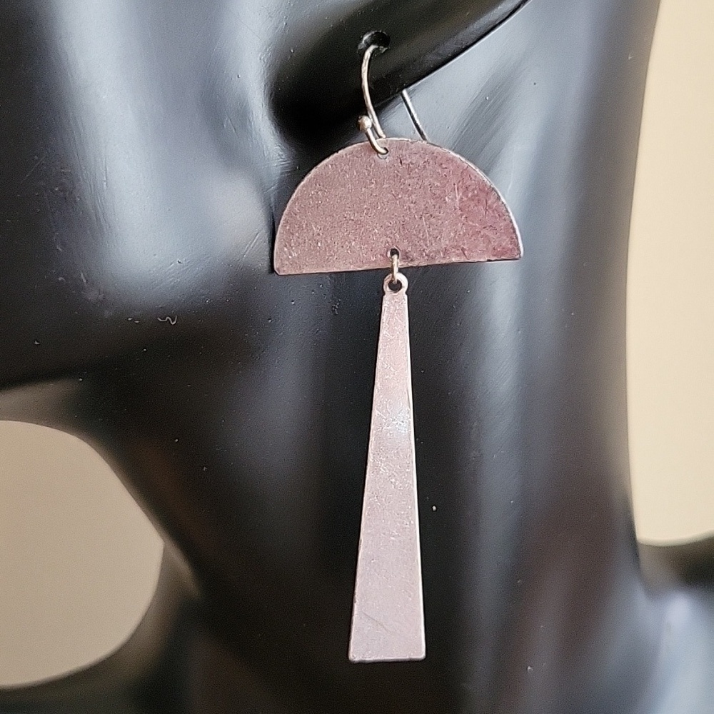 Modern contemporary silver tone earring.